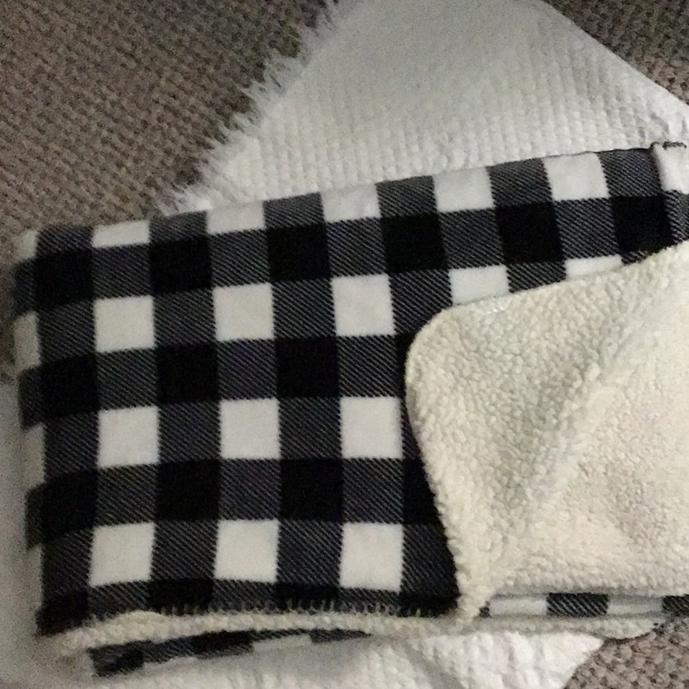 Buffalo plaid black & white check throw. Reverse side is sherpa fleece.